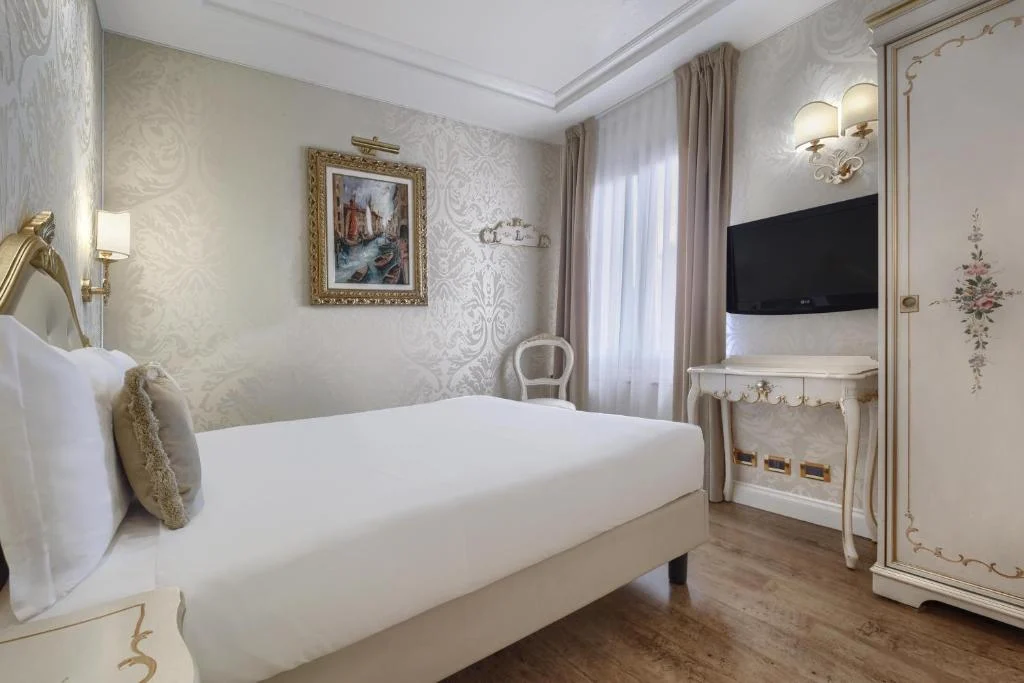 A bedroom at Hotel Olimpia A bedroom at Hotel Olimpia